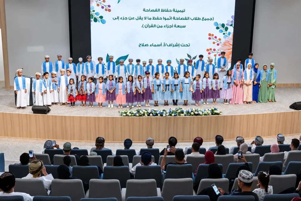 Al Fasaha pupils on stage at a school ceremony in the auditorium