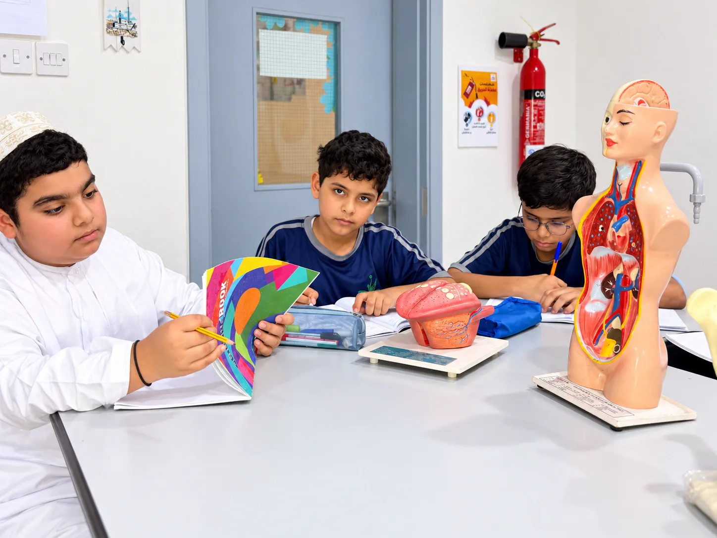 A.F.S Grade 6 pupils studying science models in the lab