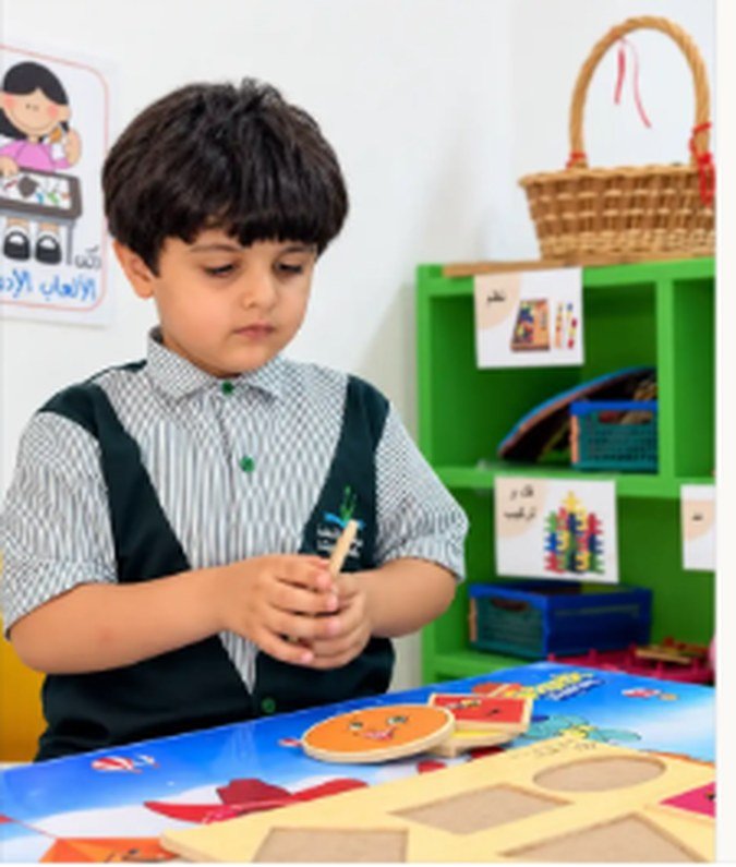 Child learning with materials at A.F.S Kindergarten