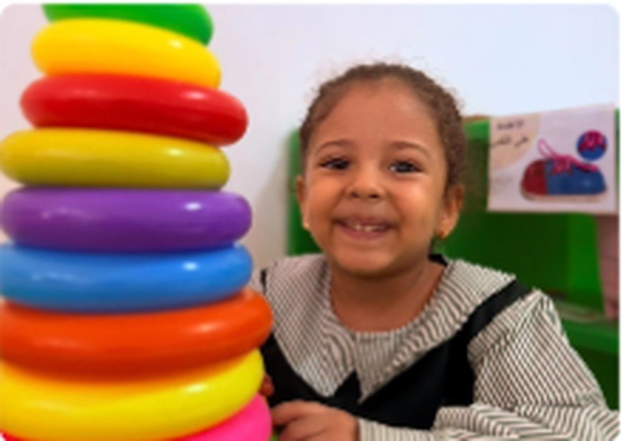 Kindergarten child exploring materials