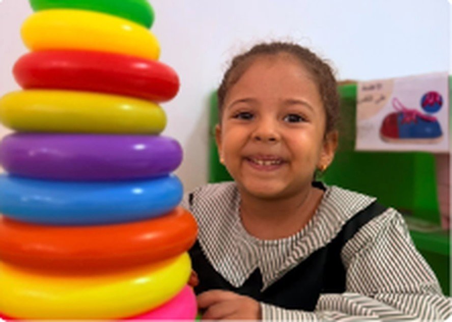 Kindergarten child exploring materials